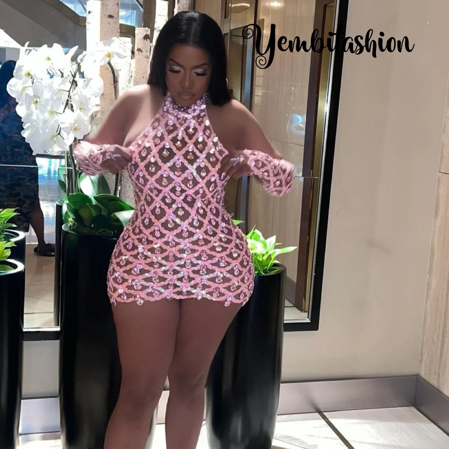 A Pink Mini Dress with rhinestone embellishments, perfect for special occasions.