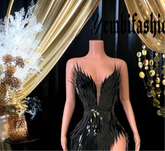 A chic black feather dress perfect for homecoming or as a stylish prom dress, featuring elegant feather details and a sleek silhouette