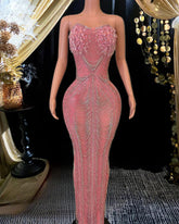 Elegant long sleeveless cocktail dress with sparkling diamante details and a flattering silhouette.