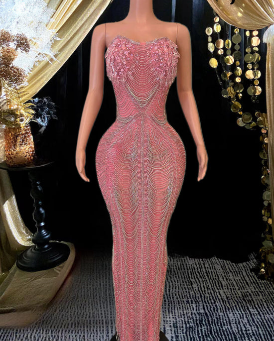 Elegant long sleeveless cocktail dress with sparkling diamante details and a flattering silhouette.