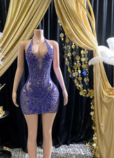 Glamorous rhinestone mini dress with a body-hugging fit, sparkling embellishments, and adjustable straps
