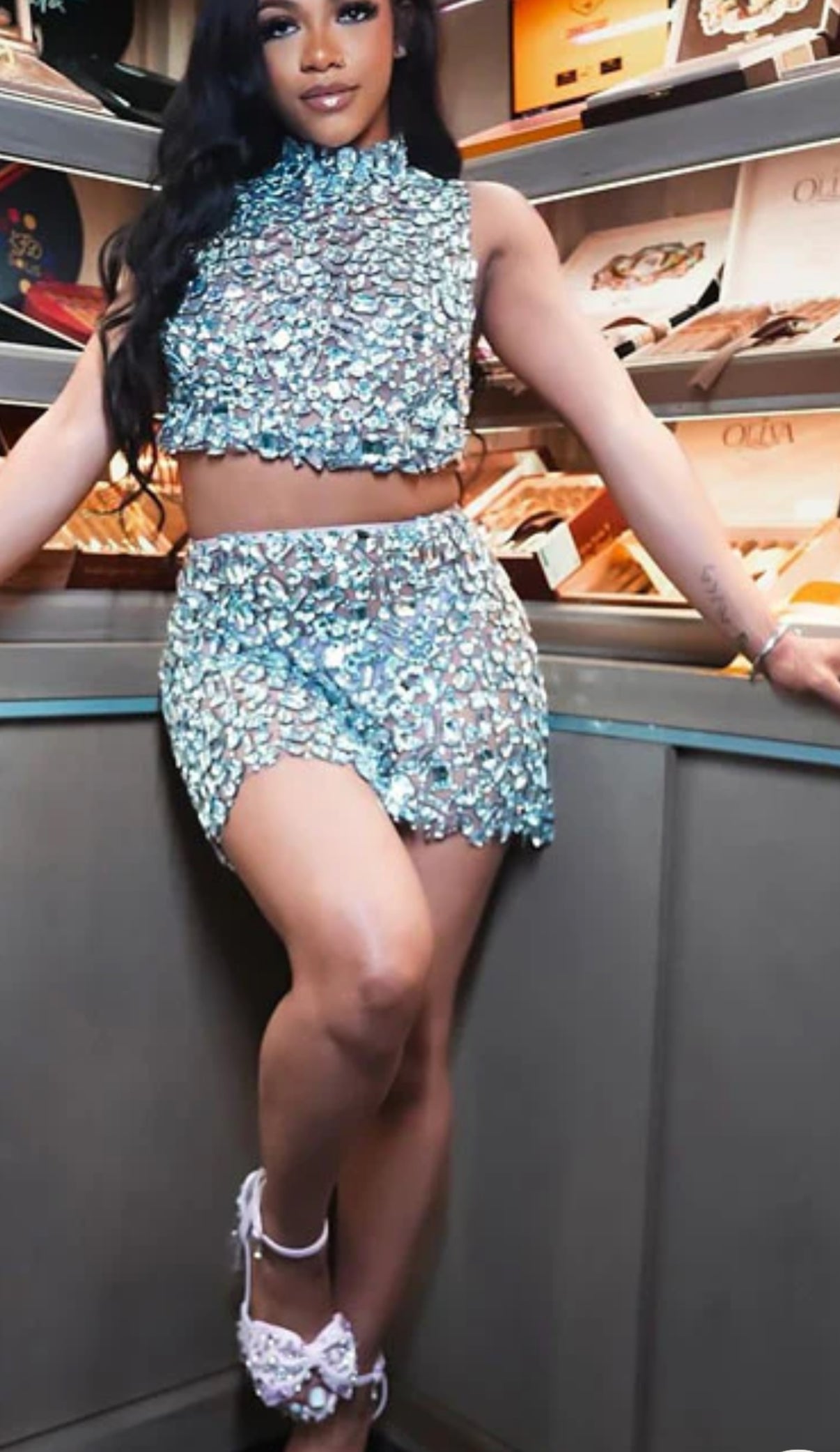 A stylish silver two-piece matching set featuring a sleek design and elegant details for versatile wear.