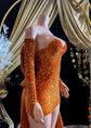 A vibrant orange Eve Sequin Evening Dress styled as a ball gown, with intricate crystal embellishments and shimmering sequins, perfect for formal occasions and elegant events.