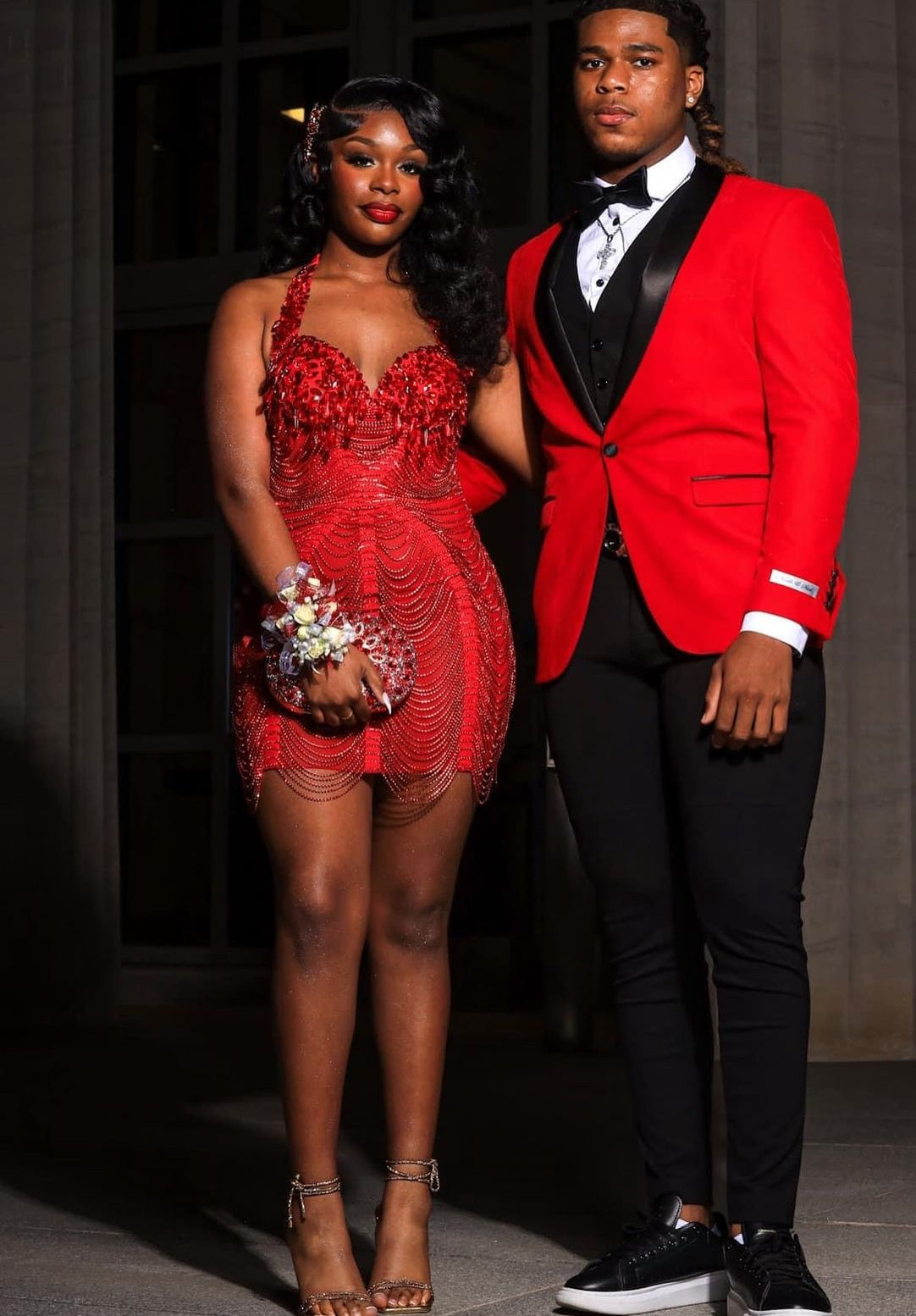 A vibrant Laure Red Mini Dress with tassel detailing, perfect for prom or special occasions