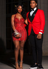 A vibrant Laure Red Mini Dress with tassel detailing, perfect for prom or special occasions