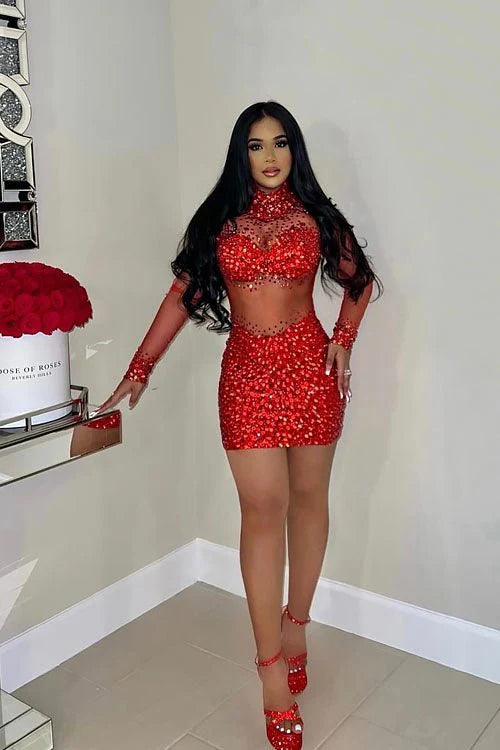 A sleek Red bodycom dress with mesh detailing, highlighting a form-fitting silhouette for an elegant and sophisticated look.