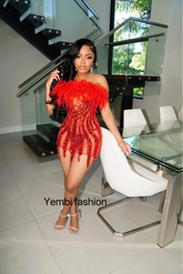 A red mini diamante dress with feather details, perfect for a glamorous evening or party