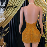 A vibrant orange Laura mini dress with tassel accents, ideal for prom or special occasions.