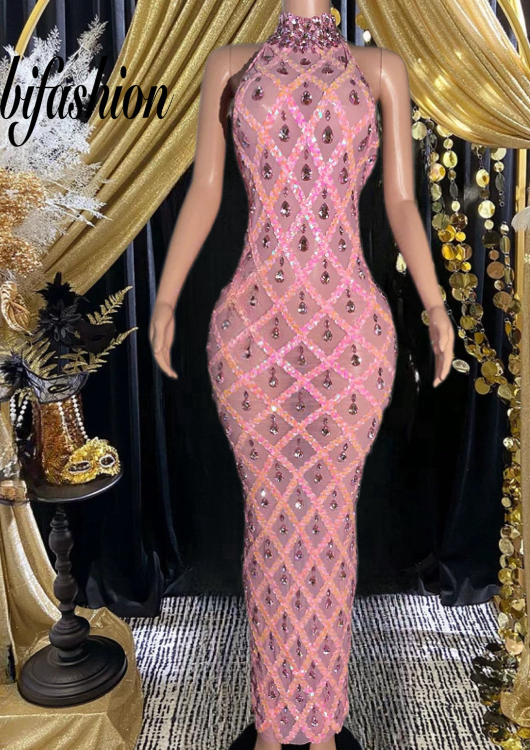 A sleek, form-fitting midnight dress with sparkling rhinestones, perfect for evening wear and special occasions.