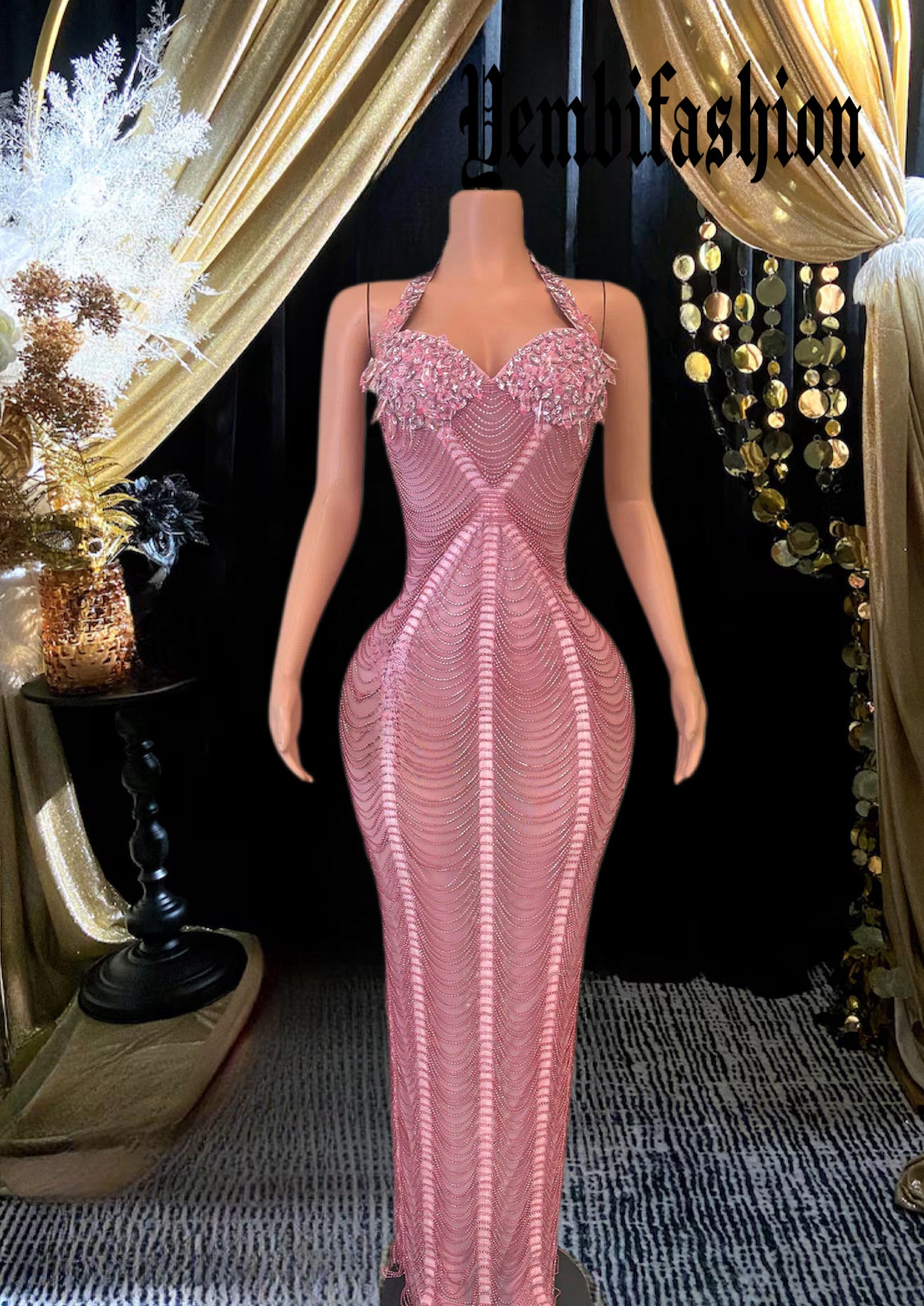 A glamorous model wearing the LAURE DIAMANTE DRESS, featuring sparkling diamante embellishments and a flattering, form-fitting silhouette perfect for elegant events.