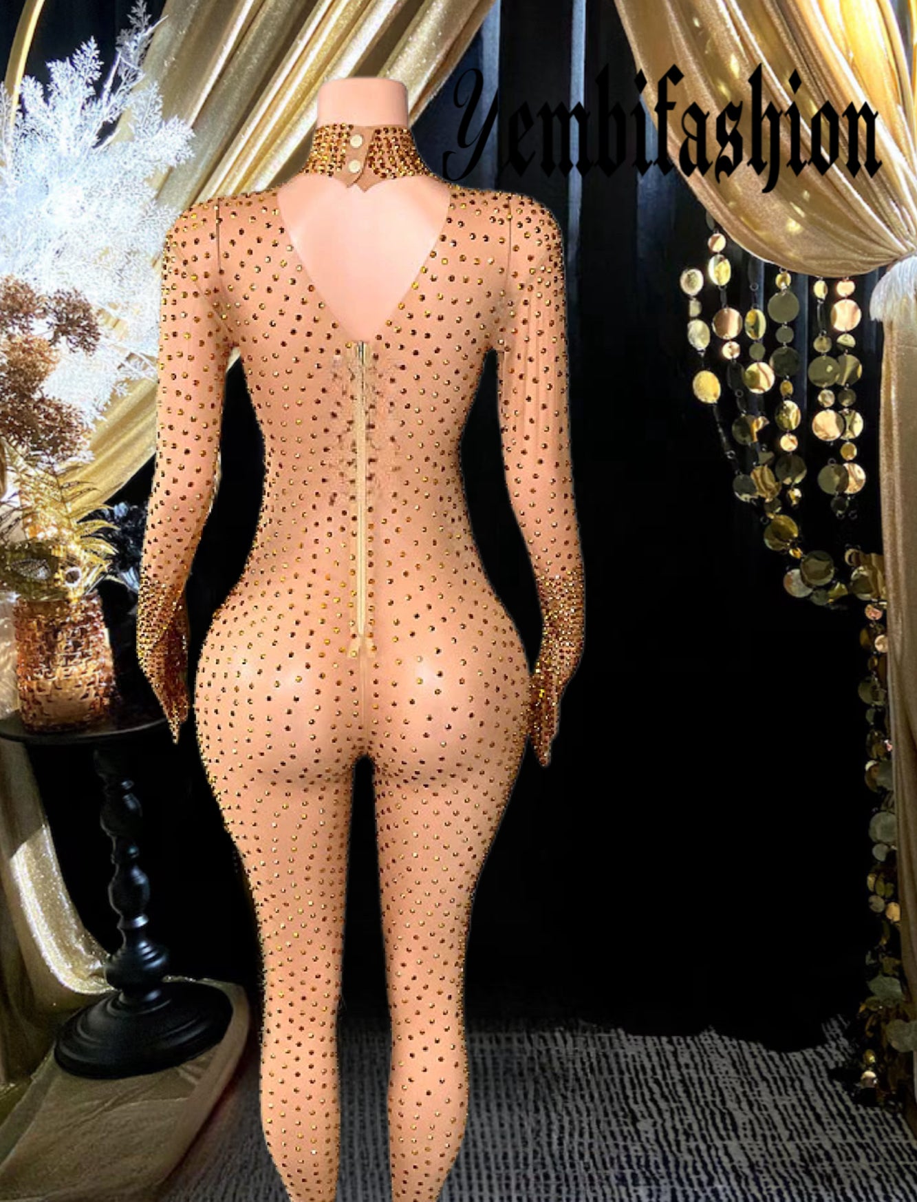 A long sleeve sequined bodysuit with shimmering details, showcasing a form-fitting design ideal for parties or stylish occasions.