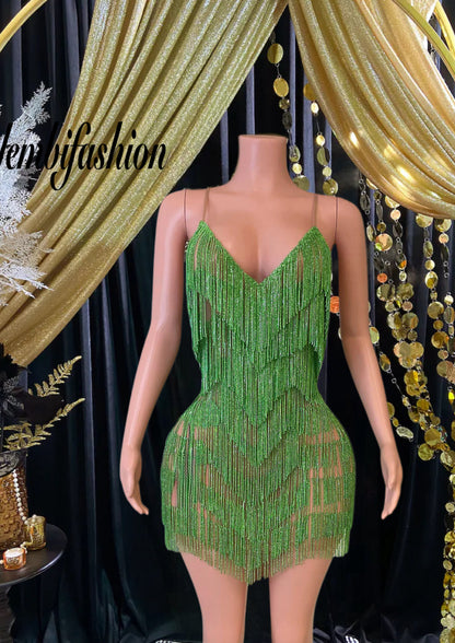 A stunning Vera Mini Tassel Dress with rhinestones and tassel accents, designed for elegance and glamour.