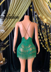 A stunning Vera Mini Tassel Dress with rhinestones and tassel accents, designed for elegance and glamour