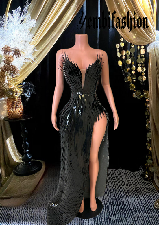 A chic black feather dress perfect for homecoming or as a stylish prom dress, featuring elegant feather details and a sleek silhouette