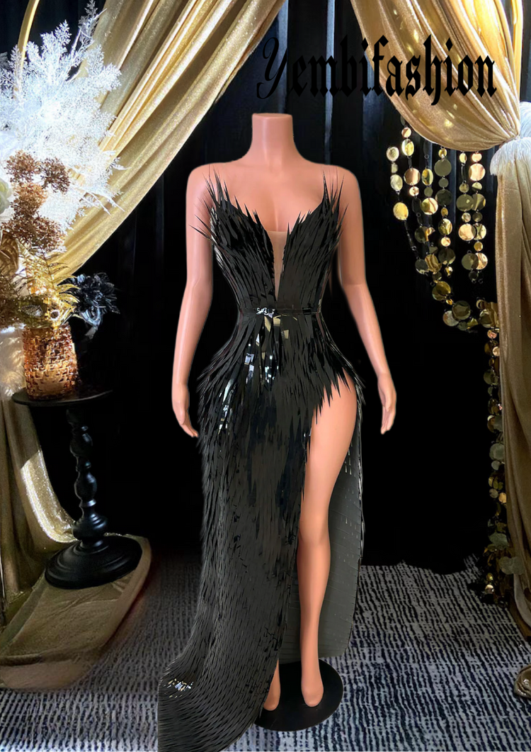 A chic black feather dress perfect for homecoming or as a stylish prom dress, featuring elegant feather details and a sleek silhouette