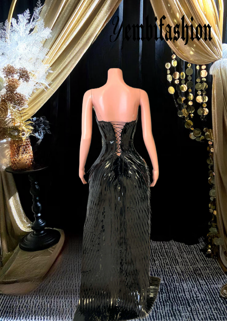 A chic black feather dress perfect for homecoming or as a stylish prom dress, featuring elegant feather details and a sleek silhouette