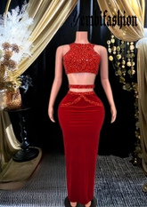 A stylish red skirt set featuring rhinestone detailing, perfect for glamorous occasions.