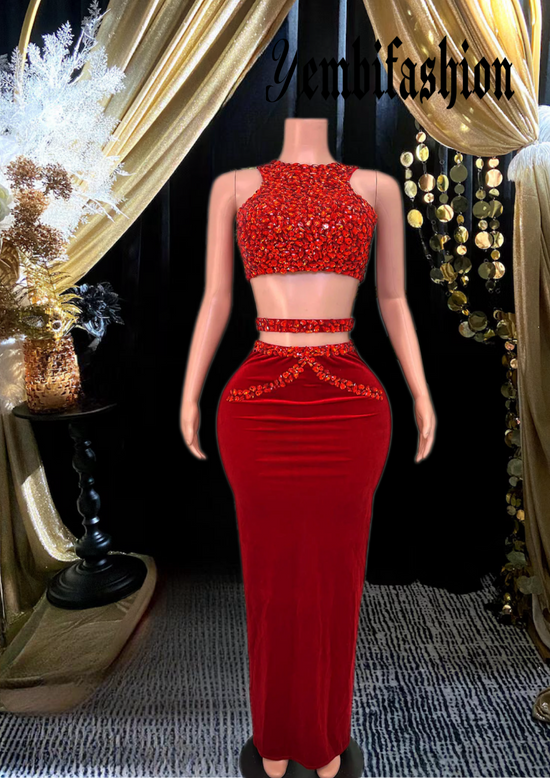 A stylish red skirt set featuring rhinestone detailing, perfect for glamorous occasions.