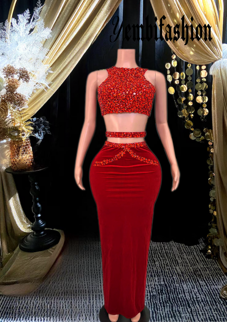 A stylish red skirt set featuring rhinestone detailing, perfect for glamorous occasions.