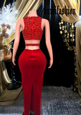 A stylish red skirt set featuring rhinestone detailing, perfect for glamorous occasions.