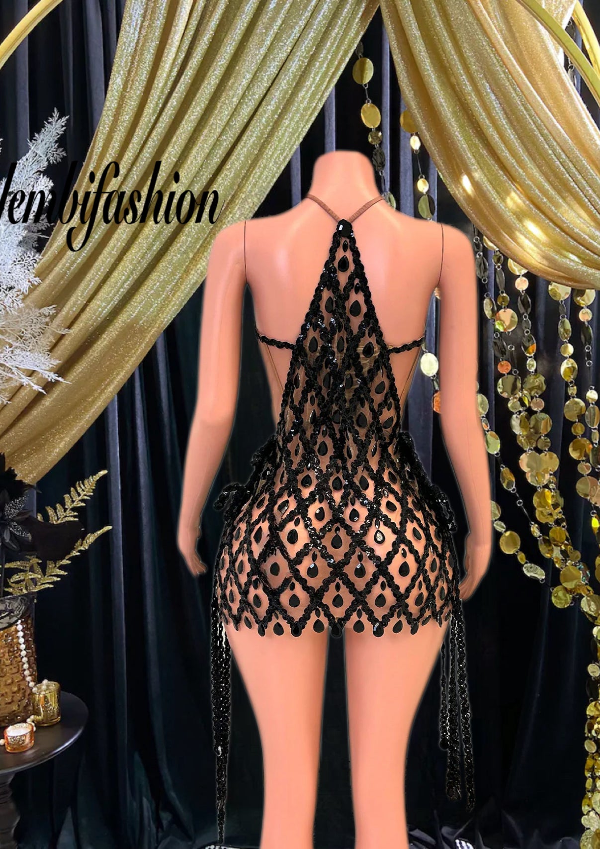 A stylish sequins mini dress embellished with rhinestone accents, perfect for a glamorous evening look.