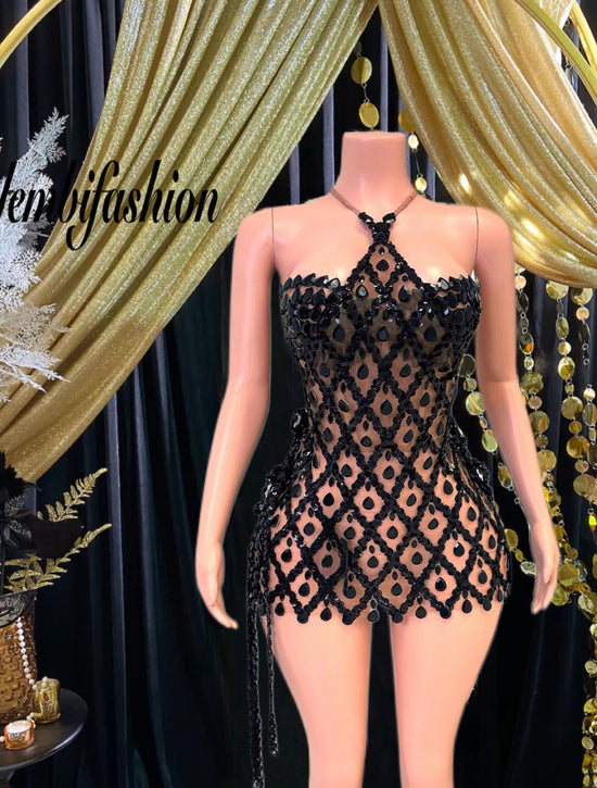 A stylish sequins mini dress embellished with rhinestone accents, perfect for a glamorous evening look.