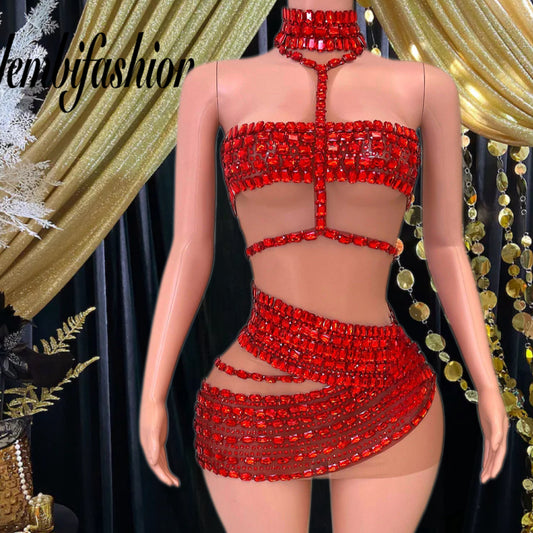 A vibrant red mini dress with crystal and rhinestone detailing, designed for elegant and bold occasions.