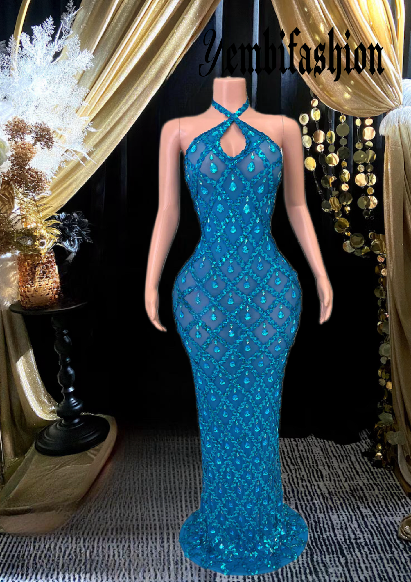 A long sleeveless midi dress adorned with rhinestones, showcasing an elegant and modern design.