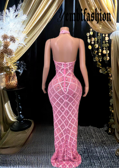 A long sleeveless midi dress adorned with rhinestones, showcasing an elegant and modern design.