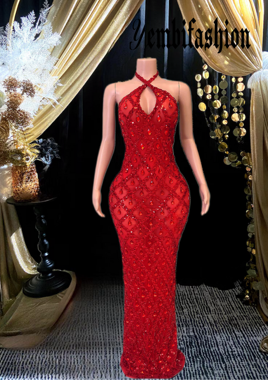 A sleeveless sequins maxi dress with rhinestones, showcasing an elegant floor-length design perfect for formal occasions.