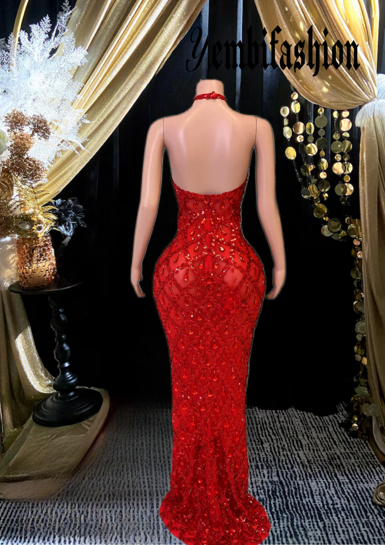 A sleeveless sequins maxi dress with rhinestones, showcasing an elegant floor-length design perfect for formal occasions.