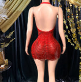 A vibrant Laure Red Mini Dress with tassel detailing, perfect for prom or special occasions