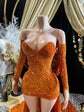 A vibrant orange Eve Sequin Evening Dress styled as a ball gown, with intricate crystal embellishments and shimmering sequins, perfect for formal occasions and elegant events.