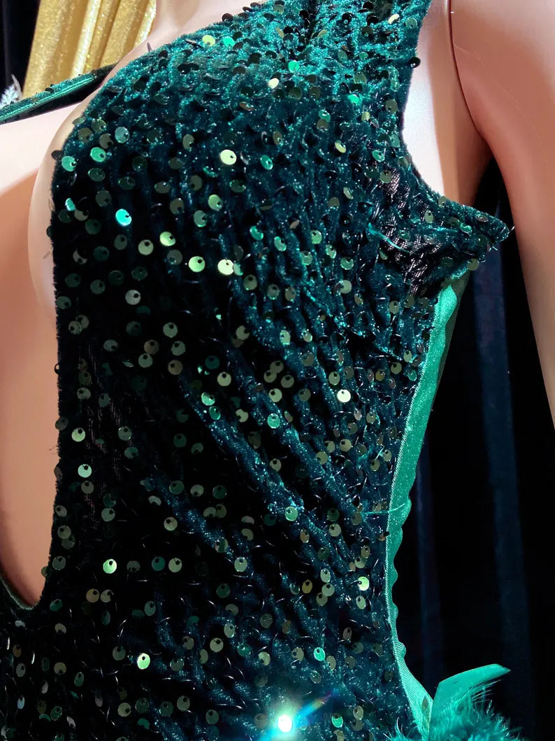 Dark green feather-embellished mini dress with rhinestone details, perfect for a birthday celebration or special event.