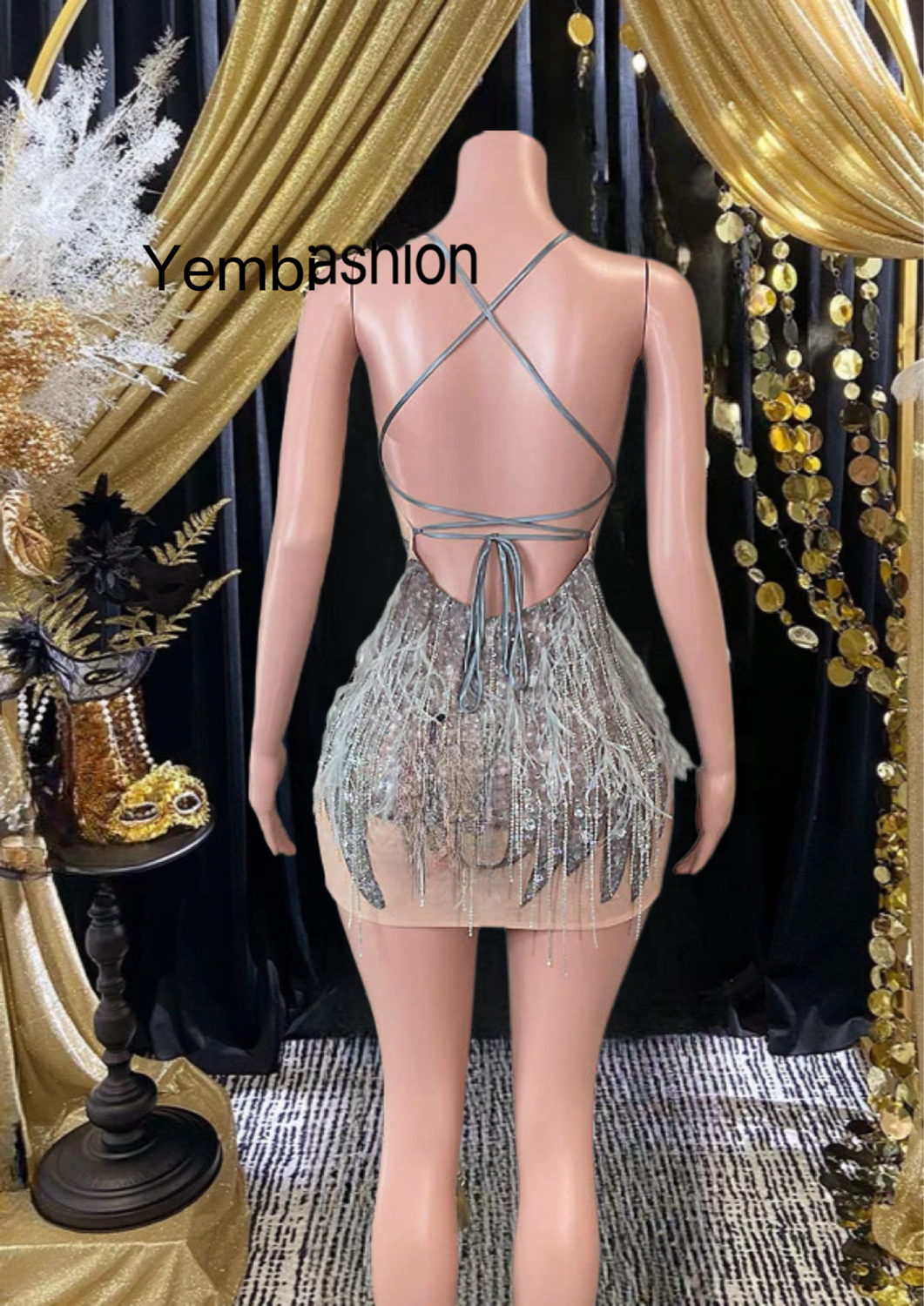 A glamorous Diamante Mirror Dress with Feather detailing, perfect short party dress.