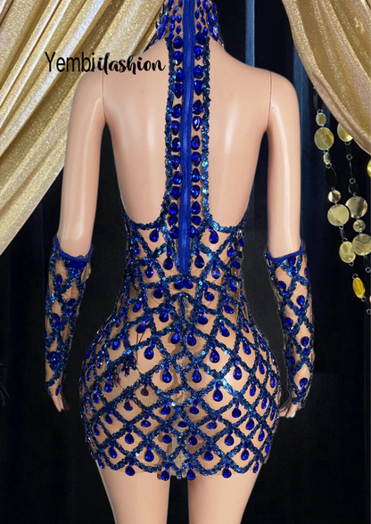 Close-up of a rhinestone dress with embellished detailing.