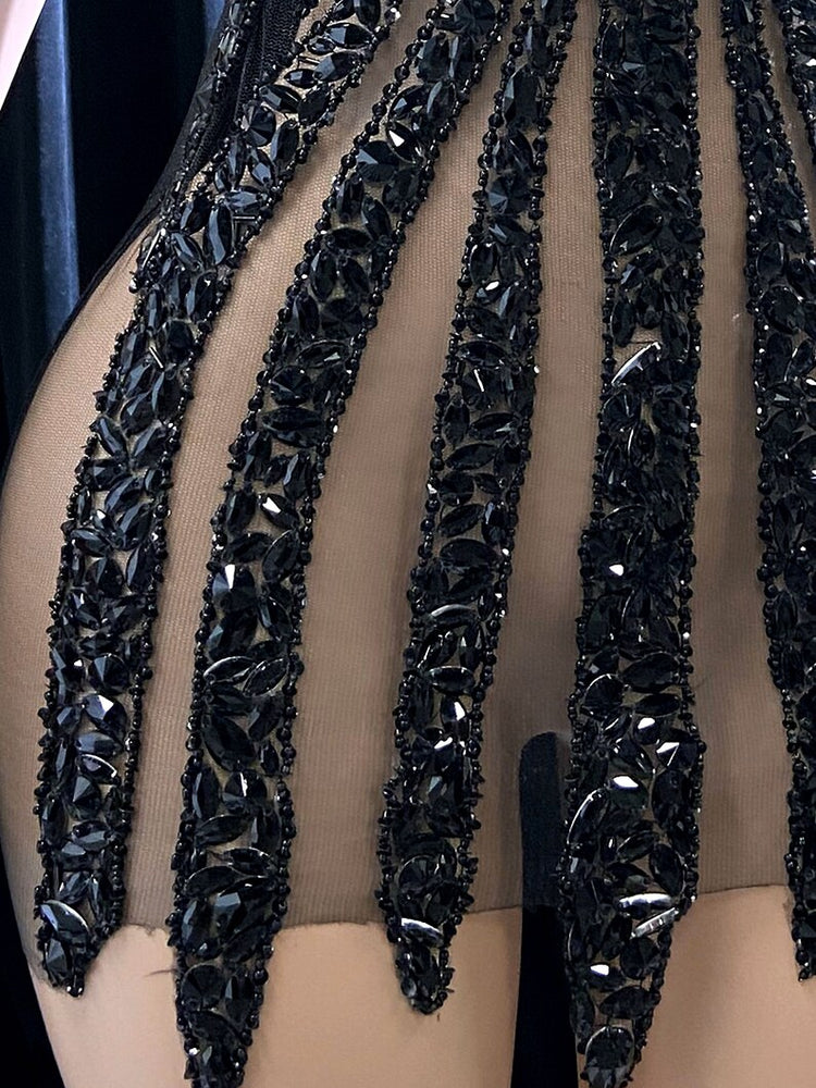 Ella Black Mini Dress featuring a tulle design and rhinestone details for a chic and glamorous look.