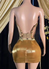 Model wearing a glamorous Rhinestone Dress Set with tassel dress details, perfect for special occasions."