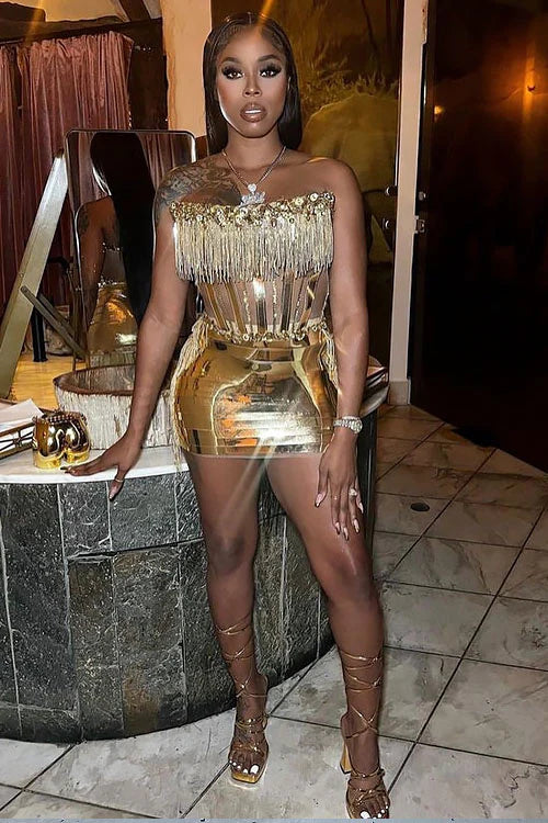 Model wearing a glamorous Rhinestone Dress Set with tassel dress details, perfect for special occasions."