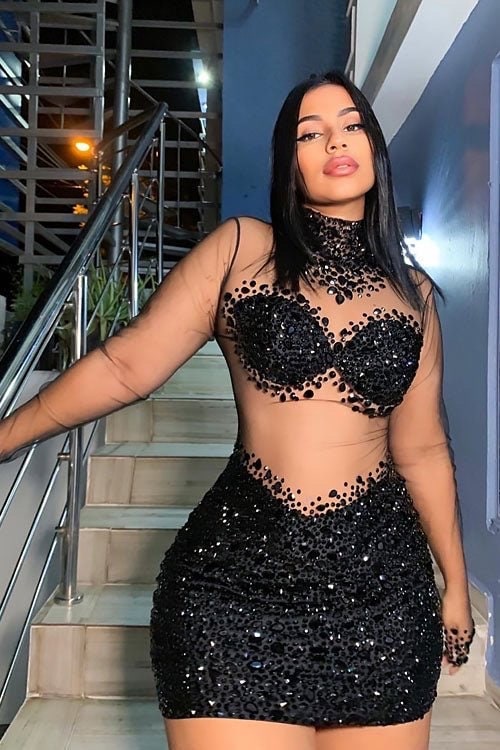 A sleek black bodycom dress with mesh detailing, highlighting a form-fitting silhouette for an elegant and sophisticated look.