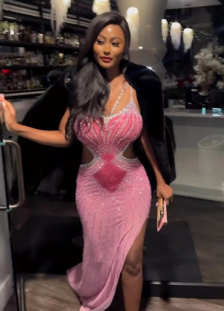 A stunning Raissa rhinestone dress in pink, perfect for an elegant evening or formal event.

