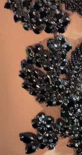 Embellished black nude dress with rhinestones and train, elegant mini dress perfect for evening wear.