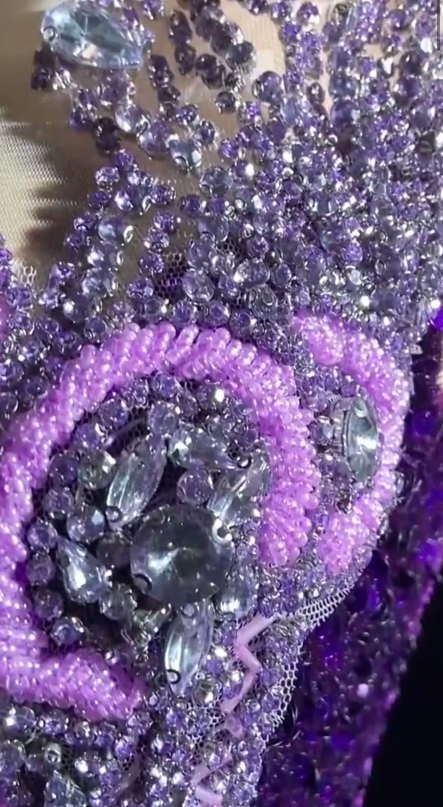 A glamorous embellished sequin dress with rhinestones, featuring a sparkling design perfect for evening wear and formal events