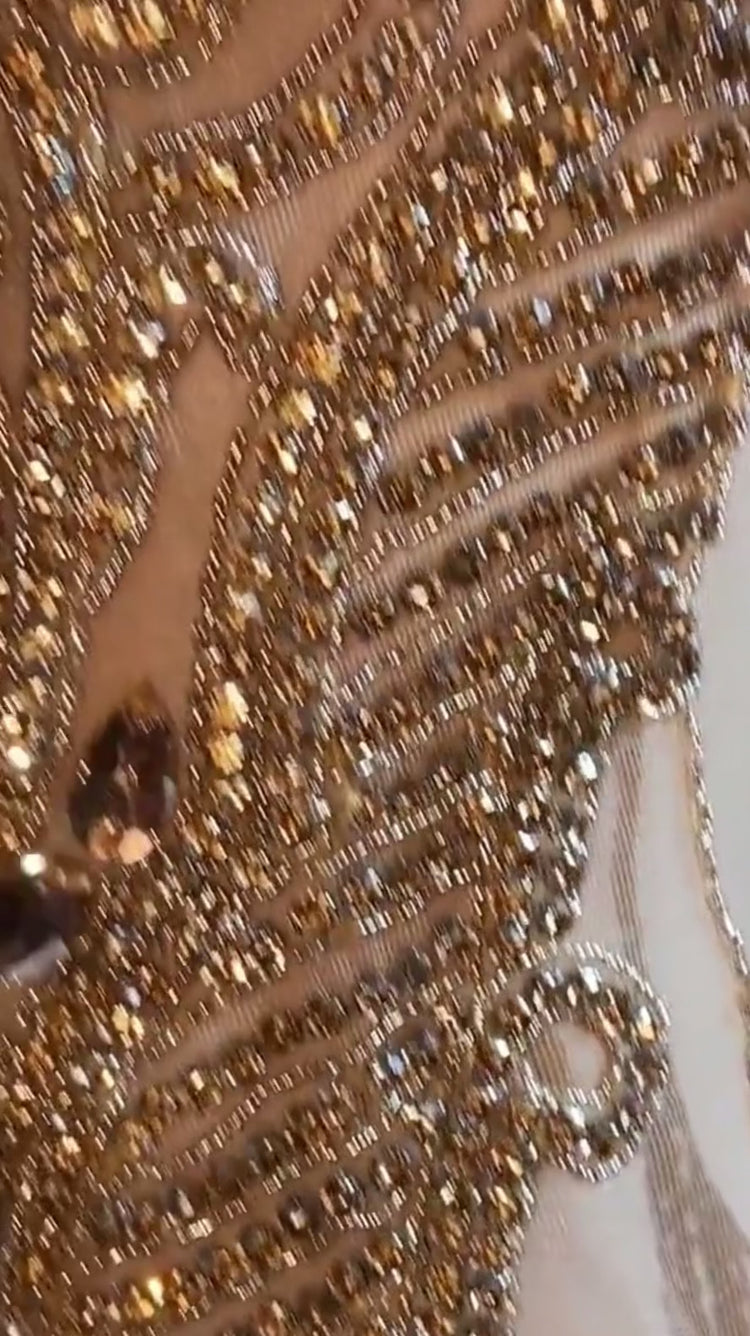 Front view of a gold rhinestone A-line mini dress with sparkling rhinestones and an elegant fit.