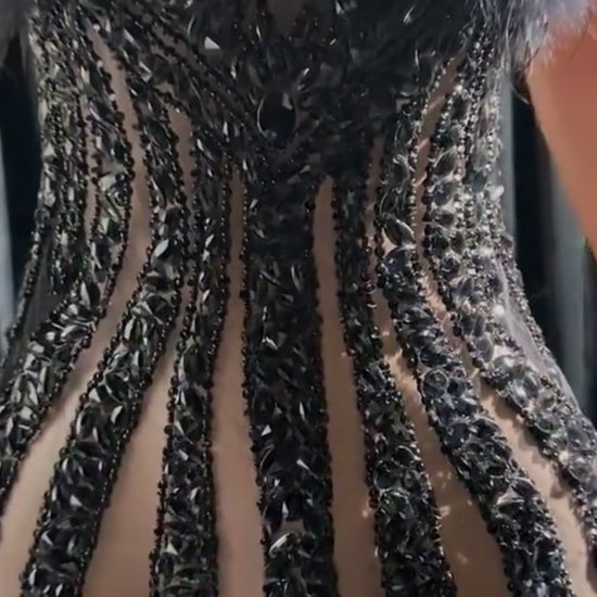 Ella Black Mini Dress featuring a tulle design and rhinestone details for a chic and glamorous look.